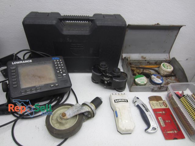 Lot 31-1292 - Binoculars, Lowrance GPS, Propane Tank Accessories, Nails, etc.