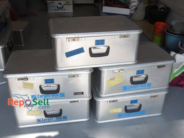Lot 31-9141 - (5) Zarges aluminum storage boxes with black handles and latching mechanisms. Each box features blue...