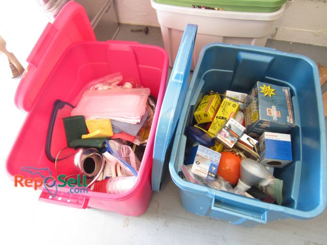 Lot 31-9205 - Two large plastic storage bins, one pink and one blue. Contents include various household items such...