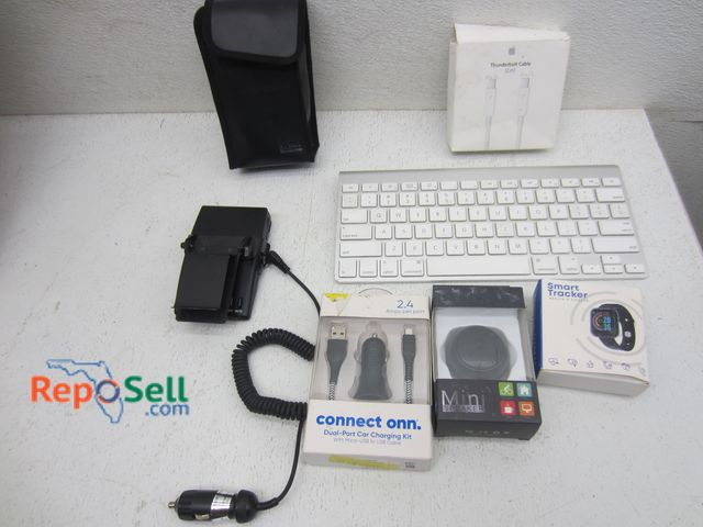 Lot 31-9238 - Electronics Lot: Apple Mini Keyboard, Charging Cables, Mini Speaker, Smart Tracker etc