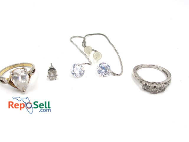 Lot 31-5002 - Jewelry Lot: .925 Diamond Ring (2.49g total), GP Ring, Earrings