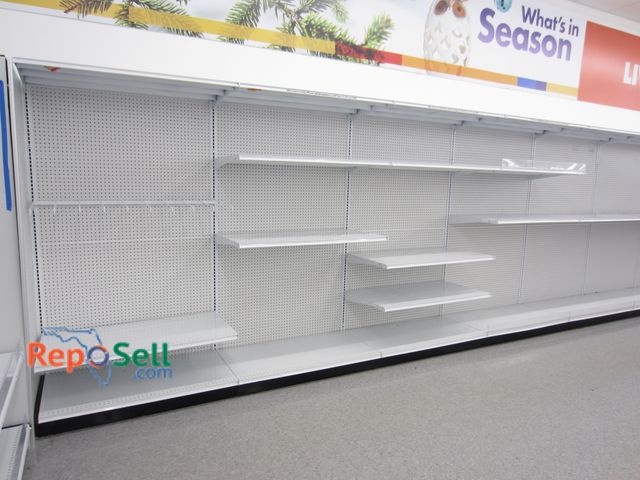 Lot 31-3008 - (18) 4' Retail Shelving w/Peg Board Backers, 25" Deep Shelves. Buyer Must Disassemble &amp; Remove.