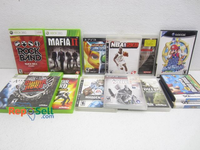 Lot 31-8143 - Game Lot: PS3, Nintendo, X-Box: COD, Guitar Hero, Mario, Assassins' Creed, etc.