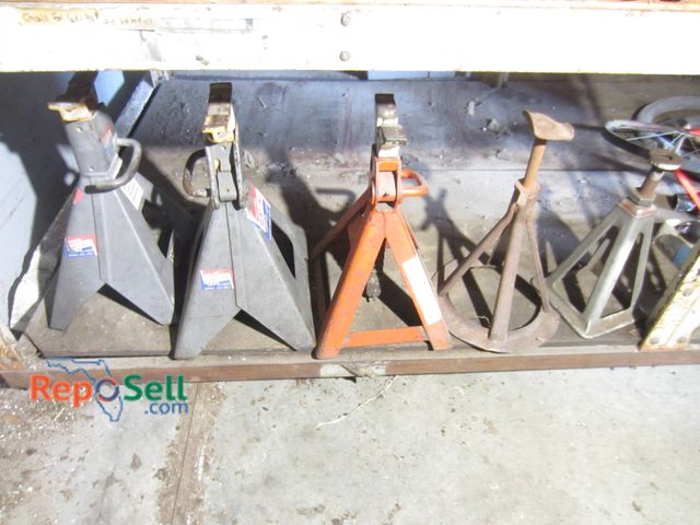 Lot 31-1289 - Five Jack Stands In Various Styles And Materials. Includes Two Pairs Of Steel Jack Stands With Locki...