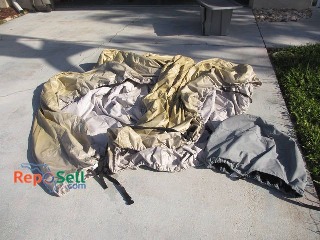 Lot 31-8582 - Polyester B Boat Cover, Size 17-19 Ft with Storage Cover and Bin