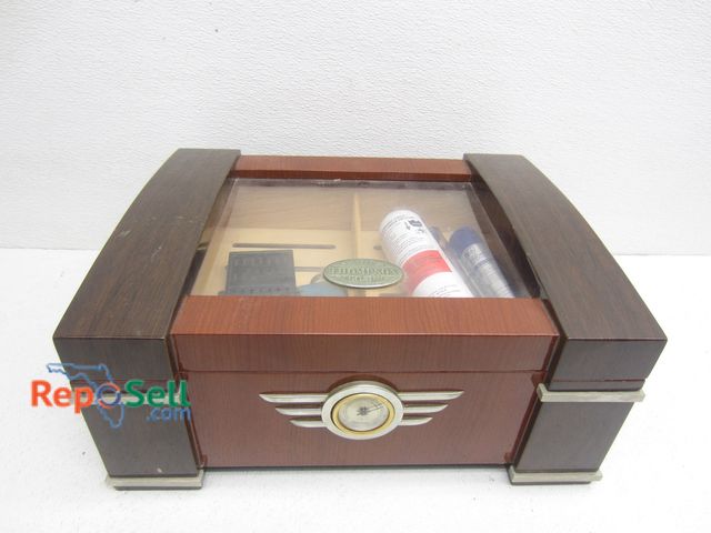 Lot 31-8550 - 1915 Thompson Humidor With Acces
