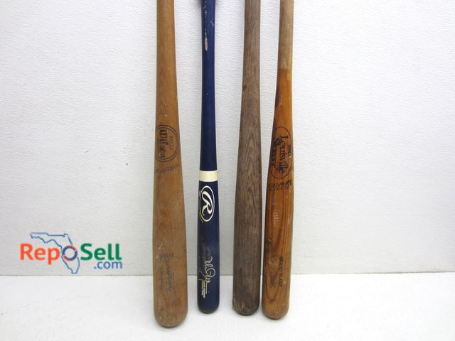 Lot 31-3549 - (4) Wood Bats: Wilson, McGuire, Louisville, Grand Slam