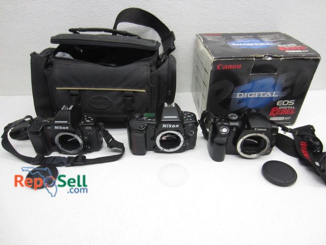 Lot 31-9518 - Camera Lot: (2) Nikon with Bag &amp; Canon Digital Rebel in Box