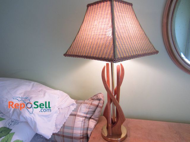 Lot 31-9033 - Wood Base With Brass Accents And Fabric Shade Measuring Approximately 34 Inches Tall.