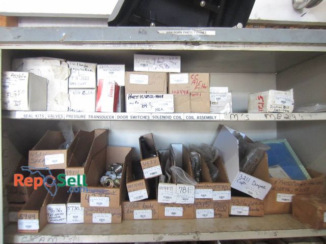 Lot 31-1162 - New Golf Cart Parts On Top Two Shelves In Storage Cabinet