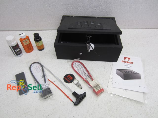 Lot 31-6248 - Gunvault Drawer Lockbox With Key And Manual With Firearm Cleaning Supplies