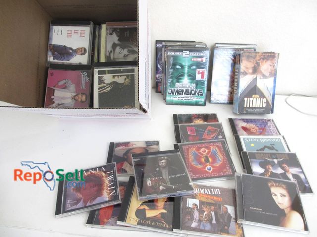 Lot 31-8536 - Music CDs And Movie DVDs Including Titanic And Roy Orbison 25+ items