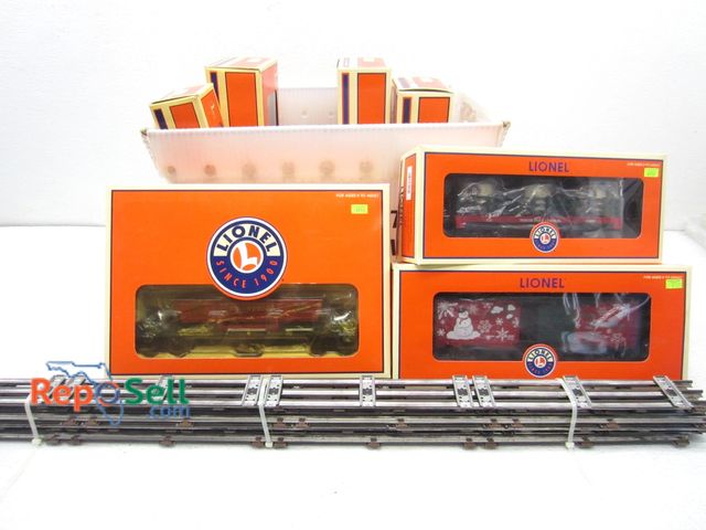 Lot 31-9146 - (7) Lionel Christmas Train Cars in Boxes, Tracks &amp; Clips