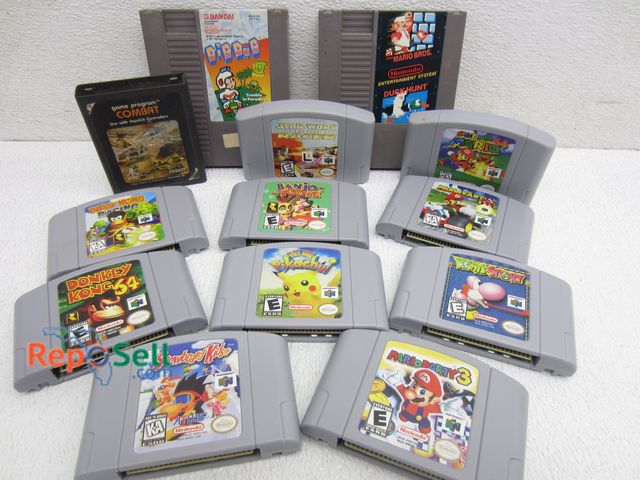 Lot 31-1180 - (12) Nintendo Games, (1) Atari Game: Mario Cart, Donkey Kong, etc.