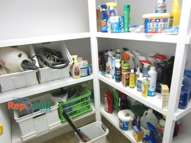Lot 31-1412 - Contents Of (3) Shelves: Cleaning Supplies, Spray Pump, Mini Shark Vacuum etc