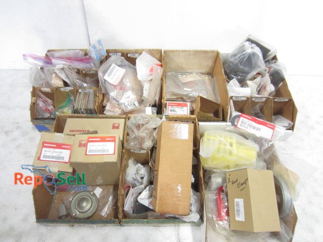 Lot 31-1251 - Honda Motorcycle Parts And Accessories. Includes Various Sealed Packages And Boxed Items With Part N...