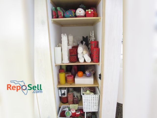 Lot 31-1166 - Content Of Living Room Closet: Candles, Christmas Decor, Ornaments etc