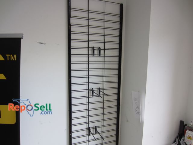 Lot 31-1189 - Retail display rack (buyer must unscrew from wall) 90" x 25"