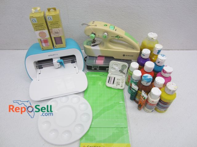 Lot 31-1088 - Cricutjoy Machine, Handheld Singer Sewing Machine (no power cord, untested) and Various Supplies