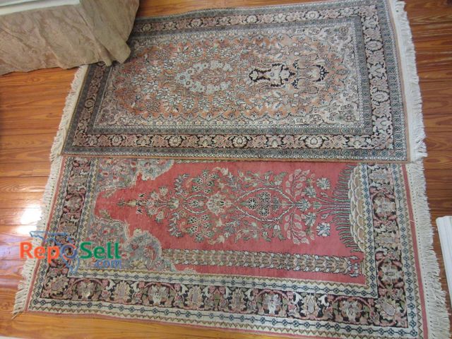 Lot 31-9047 - Two Oriental-Style Area Rugs Featuring Floral Motifs. Includes Approximate Measurements.
