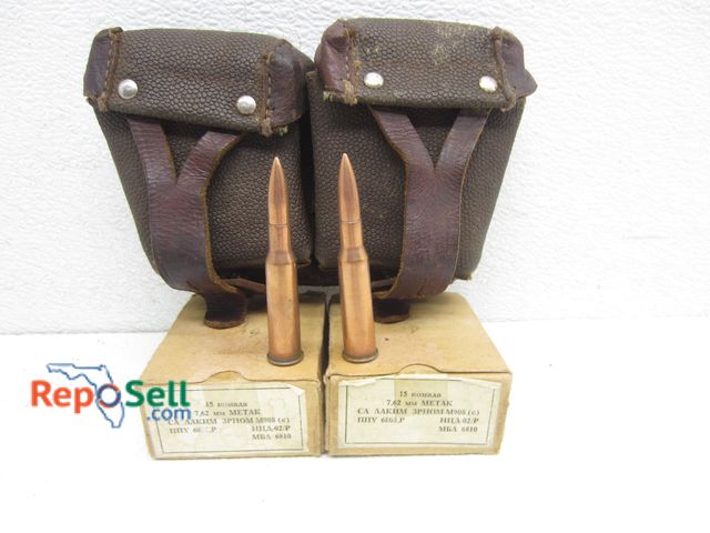 Lot 31-8506 - (30) rds Komaaa 7.62mm Metar Rounds With Leather Bell Ammo Holder - In Good Condition