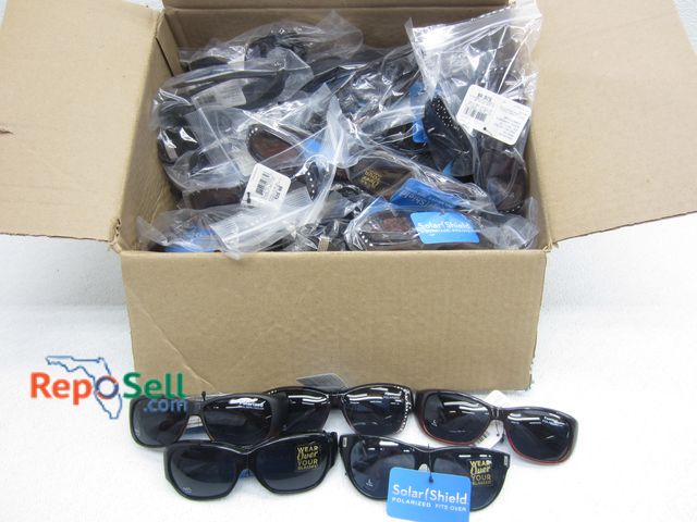 Lot 31-1218 - (50) New Pairs of Sunglasses: Foster Grant Solar Polarized/Fits Over Regular Glasses