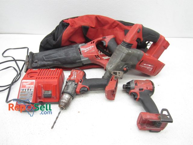 Lot 31-1125 - Lot of Milwaukee tools, charger, and bag. Rotary Hammer, Sawzall, (1) Drill power on.