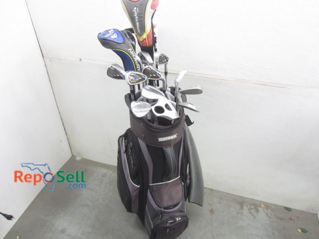 Lot 31-1257 - Datrek Golf Bag With Wheels And (16) Golf Clubs: Taylormade Burner Driver And (2) More Clubs, Nicken...