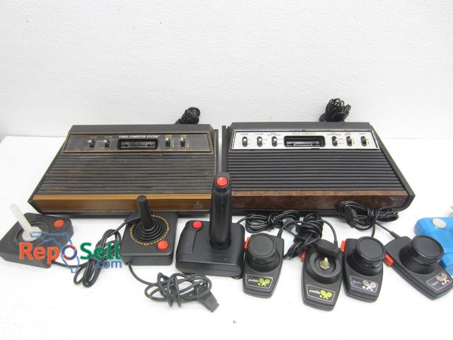 Lot 31-2110 - Vintage Lot Of Atari Video Game Systems And Controllers - Untested, No Power Cords