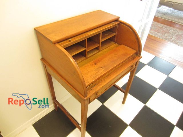 Lot 31-9000 - Wooden Roll-Top Writing Desk With Storage Compartments And A Drawer, Measuring 36x26 Inches.