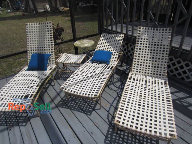 Lot 31-9221 - (3) frame lounge chairs and one square side table, all with woven white vinyl strapping. Frames are ...