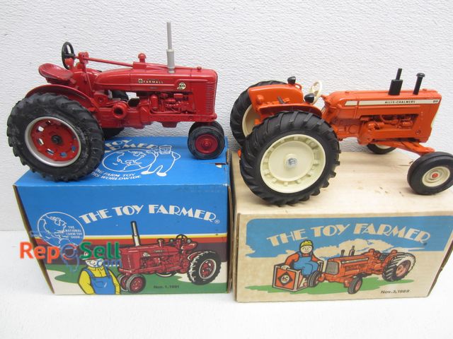 Lot 31-9379 - (2) New ERTL The Toy Farmer Tractors With Original Boxes: Allis-Chalmers D 19 And McCormick Farmall ...