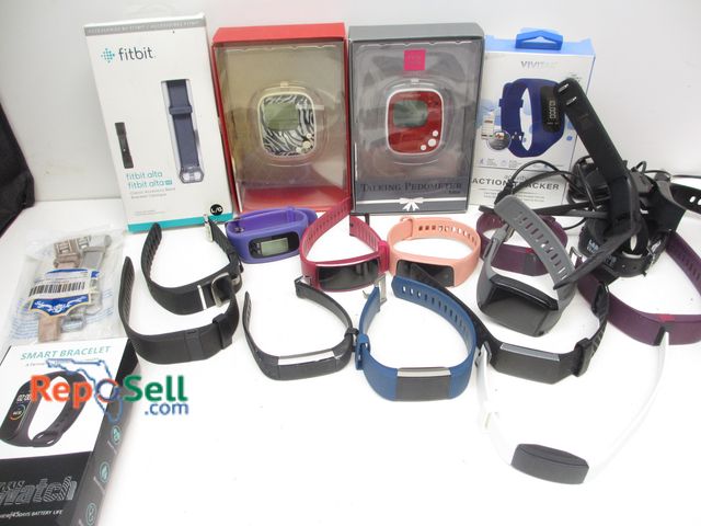 Lot 31-9516 - (16) Fit Bits, (2) New Pedometers, (2) Chargers and Bands