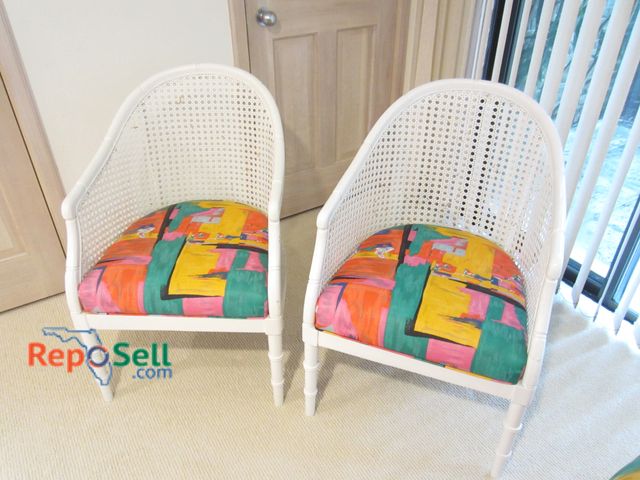 Lot 31-1210 - (2) Custom Designed White Rattan Chairs