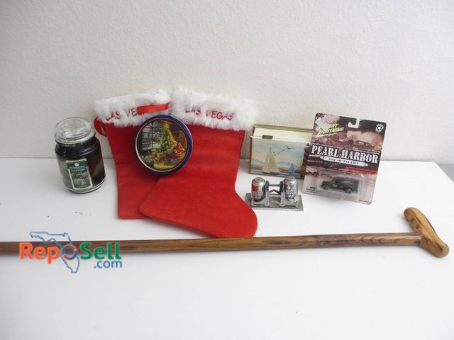 Lot 31-8552 - Collectible Lot With Las Vegas Stockings, Pearl Harbor Model, Wood Cane, And Decor