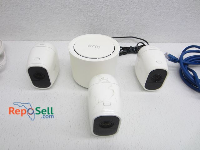 Lot 31-3059 - (3) Arlo Cameras With Base Station - All Power On