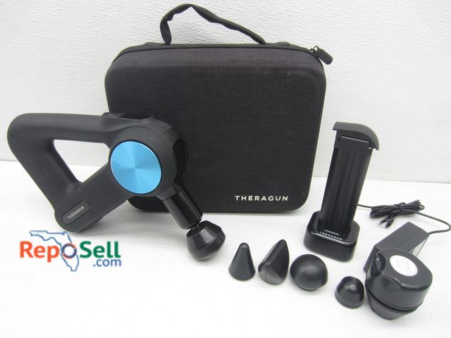 Lot 31-1172 - Theragun w/Case, (2) Batteries, Charger &amp; Accessories - Powers On