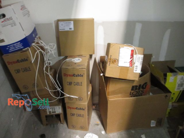 Lot 31-3150 - Contents of Back Wall: Assorted Boxes Wiring, Atras 24AWG, (5) Speaker Grille Assembly, Dyna Solid C...