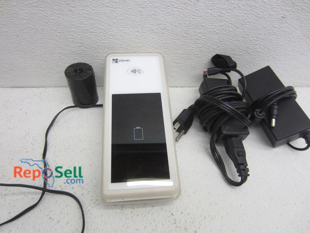 Lot 31-8117 - Clover Card Reader w/Charging Cradle, Roll of Receipt Paper &amp; Adapters - Powers On