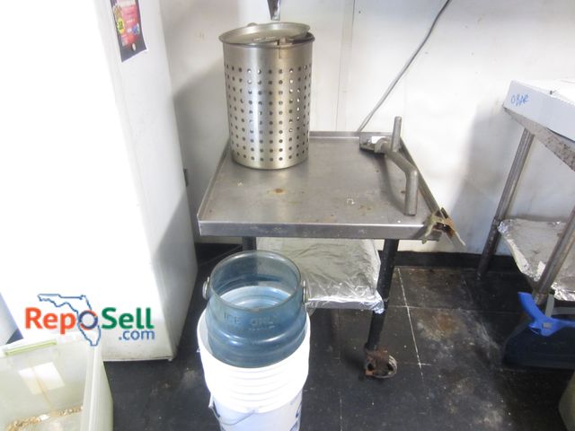 Lot 31-2047 - Rolling Metal Table w/Kitchen Items - Ice Buckets, Grill Cleaner, etc. 29"H x 24"W