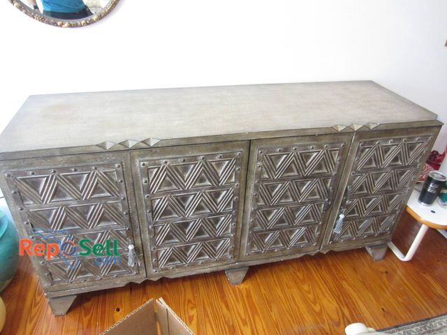 Lot 31-9123 - Four-door metallic sideboard with a geometric pattern, featuring interior shelving. ( NO CONTENTS) 7...