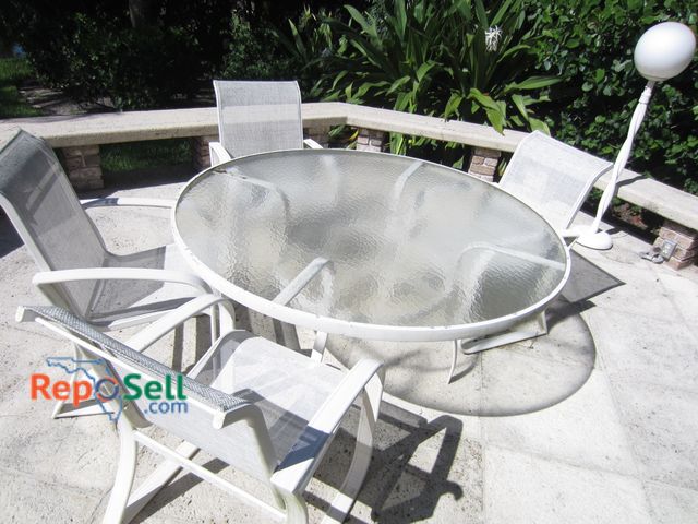 Lot 31-1411 - (4) Outside Patio Chairs And Metal Table With Glass Top 5' W