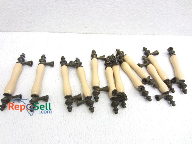 Lot 31-8560 - (12) Brass And Porcelain Drawer Pulls