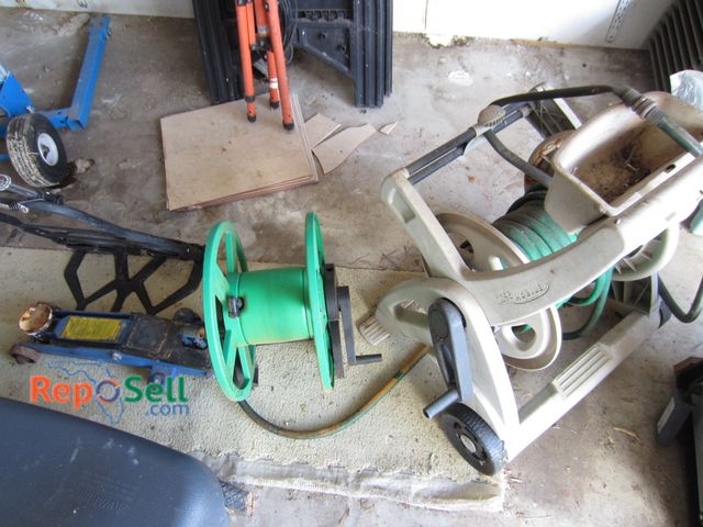 Lot 31-2083 - 2 Garden Hose Reels, Floor jack and small dolly