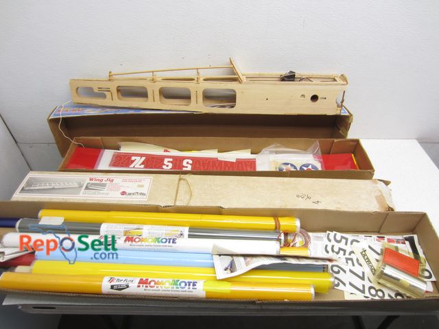 Lot 31-6191 - Parts And Supplies For RC Airplanes: Wing Jig, Stickers, Monokote Rolls etc