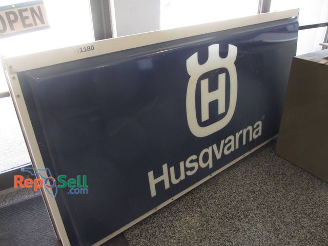 Lot 31-1180 - Husqvarna brand double-sided plastic sign measuring 6 feet by 37 inches. Features a blue background ...