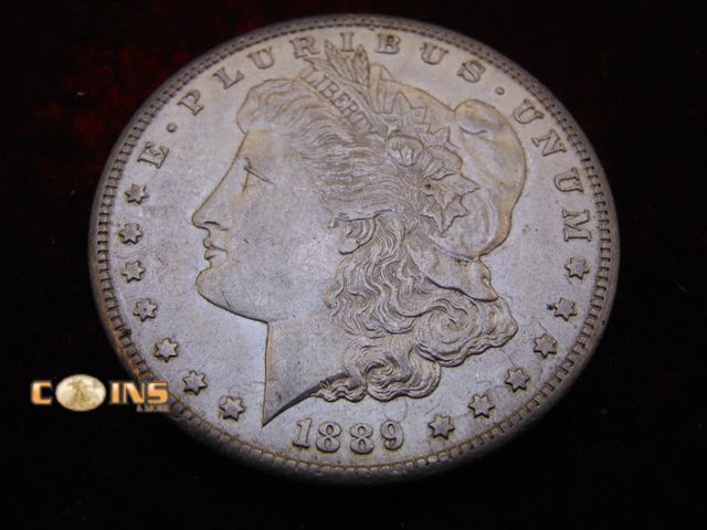 Lot 36-087101 - BETTER 1889-S Morgan Silver Dollar.