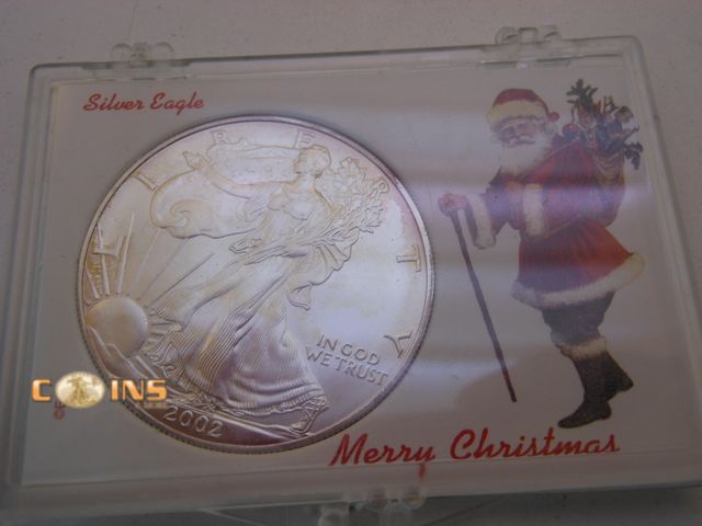 Lot 36-486719 - UNC/BU 2002 Silver American Eagle in Christmas Holder.
