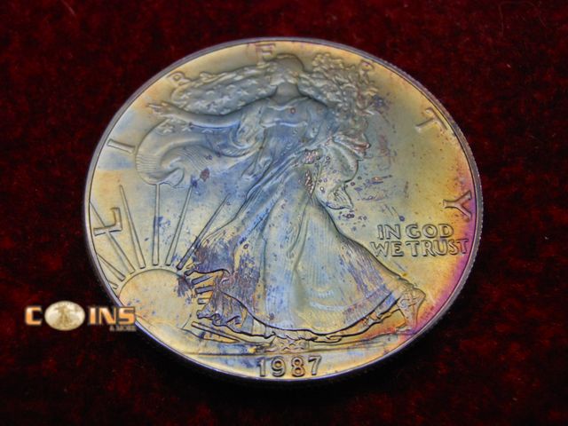 Lot 36-238155 - UNC/BU 1987 Beautifully Toned Silver American Eagle, One Troy Ounce .999 Fine Silver.