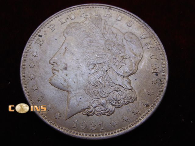 Lot 36-487288 - Better 1921 Morgan Silver Dollar.